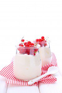 dairy dessert (yogurt) with red currant berries